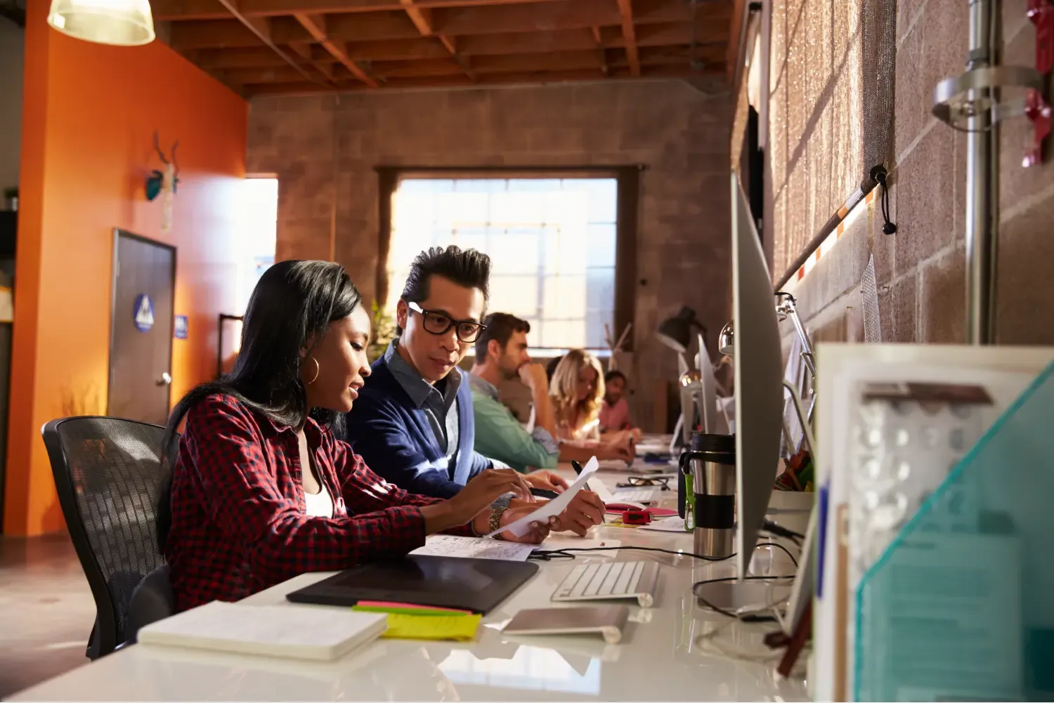 photo of office employees collaborting at a desk